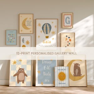 May include: A collection of 12 framed art prints with a nursery theme. The prints feature illustrations of a moon, stars, a hot air balloon, a bear, and the alphabet. Text includes "Love You to the Moon and Back", "Dream Big little one", and "You are my Sunshine".