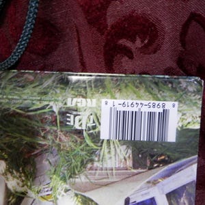 May include: A rectangular product cover featuring a photographic print of green grass and a white structure. A white barcode label with the number 8 8985-44919-1 8 is printed on the right side, alongside the RCA logo and text in white.