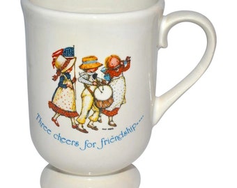 c1970s Holly Hobbie "Three Cheers for Friendship" Ceramic Footed Mug