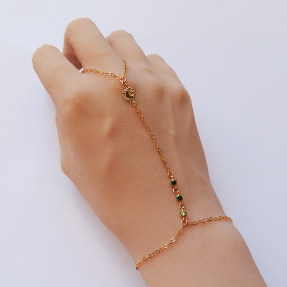 peridot hand chain with moon charm in gold filled, dainty chain ring bracelet, connected ring finger bracelet