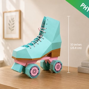 May include: A teal and pink roller skate, approximately 25.4 cm tall, with white laces and brown accents. The wheels are pink with teal and pink detailing. The image is labeled "PHYSICAL KIT".