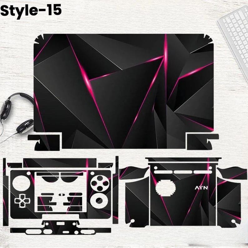 May include: Black and pink geometric design laptop skin and controller skins. The design features a series of black triangles with pink accent lines. The image also includes a keyboard, headphones, and the text "Style-15".