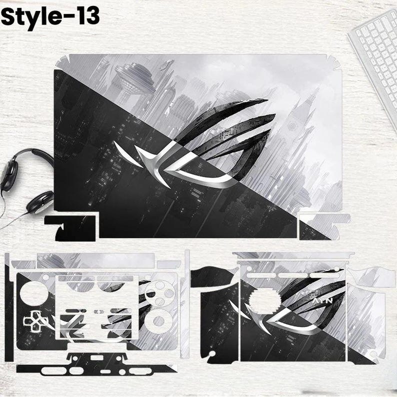 May include: A black and white laptop skin set with a futuristic city design and the text "Style-13". The set includes skins for the laptop lid, keyboard area, and other components, featuring the ROG logo.