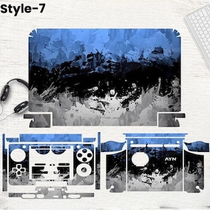 May include: A set of blue, black, and gray abstract patterned skins for a gaming device. The skins include pieces for the top, sides, and controller. The text "Style-7" is in the upper left corner, and the text "AYN" is on one of the skins.