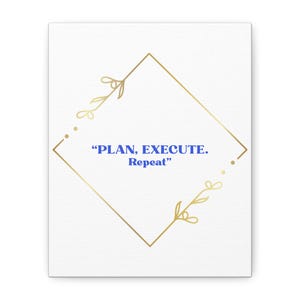 May include: A white canvas print with a gold geometric frame and the text "PLAN, EXECUTE. Repeat" in blue. The frame has decorative floral elements at the corners, creating a minimalist and motivational design.
