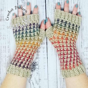 May include: A pair of crocheted fingerless gloves with a rainbow ombre pattern. The gloves are made with a textured stitch and have a beige base color. The text "Crochet Pattern Made by Jillian" is visible in the top left corner of the image.