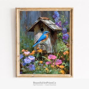 May include: An oil painting in a gold frame depicting a bright blue bird perched on a weathered wooden birdhouse. The scene is surrounded by vibrant purple, pink, and orange flowers set against a dark wooden fence background.