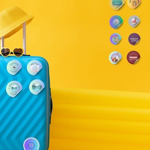 12 Canada City Glitter Badge Stickers – Retro Souvenir Set (Digital Download) on blue suitcase by Alter Standard