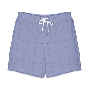 May include: Light purple swim trunks featuring a dark grey grid pattern, an elastic waistband, and a white drawstring cord with silver-toned metal aglets at the ends. The shorts have a clean, simple construction with visible stitching details.