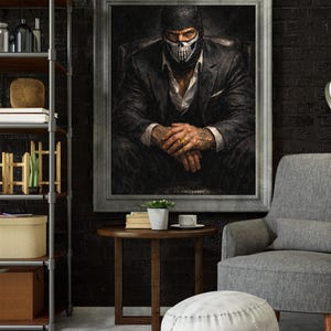 May include: A framed portrait of a person wearing a black balaclava with a skull design, a suit, and a white shirt. The person is seated in a dark chair with hands clasped. The room has a dark brick wall, a side table, and a gray armchair.