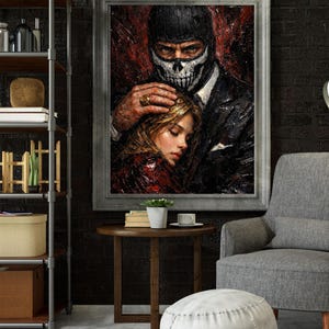 May include: A framed painting depicts a man in a black suit and skull mask holding a woman. The artwork has a dark, dramatic color palette with red and black tones. The man's hand rests on the woman's head, creating a sense of protection.