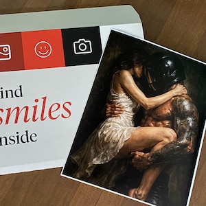 May include: A white envelope with red and black accents, featuring icons and the text "Find smiles inside." Beside it, a print depicts a couple embracing, with one wearing a helmet and the other in a white dress.