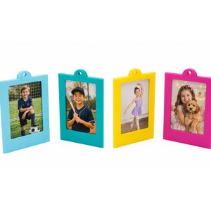 May include: Four rectangular picture frames in light blue, teal, yellow, and hot pink. Each frame features a top tab with a circular hole for hanging. The frames display photographs of children engaged in various activities like sports and dance.