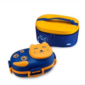 May include: Blue and orange cat-shaped lunchbox with paw prints and a smiling cat face on the lid. A matching blue and yellow insulated lunch bag with a handle is also shown. The lunchbox has a secure latch.