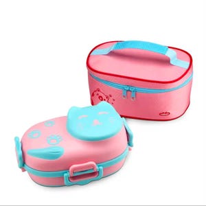 May include: Pink and blue cat-shaped lunch box and matching insulated bag. The lunch box has a cat face on top and paw prints. The bag has a handle and a zipper closure. Both items are pink with blue accents.