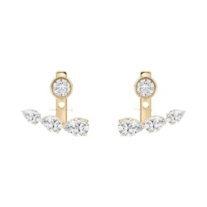 May include: A pair of gold earrings featuring a round brilliant-cut diamond stud at the top, connected to a curved bar that holds three pear-shaped diamonds of varying sizes, arranged in a cascading design with a polished gold metal finish.