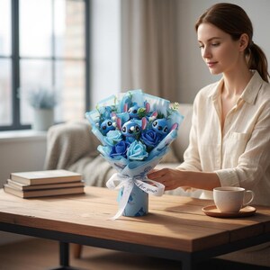 Close-up of the Stitch plush figures nestled among blue artificial roses.