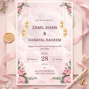 Puede incluir: Una tarjeta de invitaci&oacute;n de boda con un fondo de nubes rosa suave, rosas rosadas y linternas doradas colgantes. El texto dice: You Are Invited To ZAMIL KHAN & DANAYAL RAHEEM, Sunday July 28 2026 at 8AM, 123 ANYWHERE ST, ANY CITY, ST 12345.
