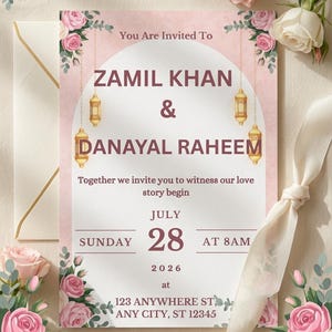 Puede incluir: Una tarjeta de invitaci&oacute;n de boda con rosas rosas, hojas verdes y linternas doradas colgantes. El texto dice: You Are Invited To ZAMIL KHAN & DANAYAL RAHEEM, Together we invite you to witness our love story begin, JULY 28, 2026, at 123 ANYWHERE ST.