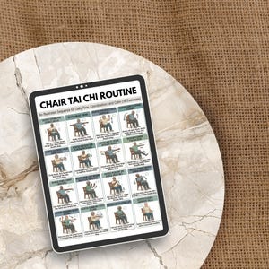 May include: A digital tablet displays a "Chair Tai Chi Routine" guide with 16 illustrated exercises. The guide is white with black text and illustrations of seated Tai Chi poses. The tablet rests on a white, circular surface against a brown burlap background.