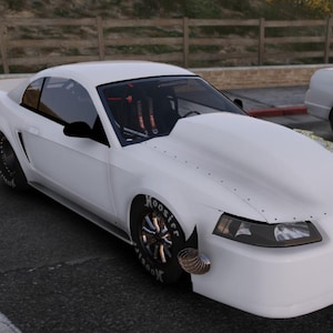 May include: A white sports car with a custom hood and black wheels is parked in a parking lot. The car has a spoiler and a racing-style interior. Another white car is parked next to it.