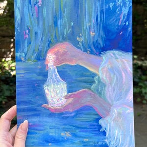 May include: An original painting depicting a person pouring liquid from a decorative glass bottle into their open hand. The artwork features a blue and pink color palette, with a dreamy, ethereal quality. The background suggests a natural, water-filled environment.