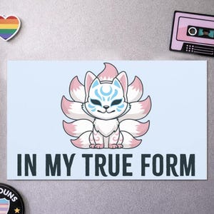 May include: A white ceramic mug with a black handle and the text "But First, Coffee" in a bold, black font. The mug is set against a blurred background, suggesting a cozy setting.