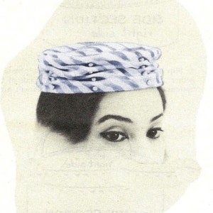 May include: A woman wearing a blue and white striped hat with white pearl accents. The hat is a pillbox style and sits on top of her head.