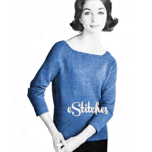 May include: A blue knitted sweater with a scoop neck and long sleeves. The sweater is photographed on a model against a white background. The text "e.Stitches" is visible on the sweater.
