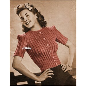 May include: A vintage knitting pattern featuring a woman wearing a pink knitted cardigan with a button-up front and short sleeves. The pattern is titled "Stitches".