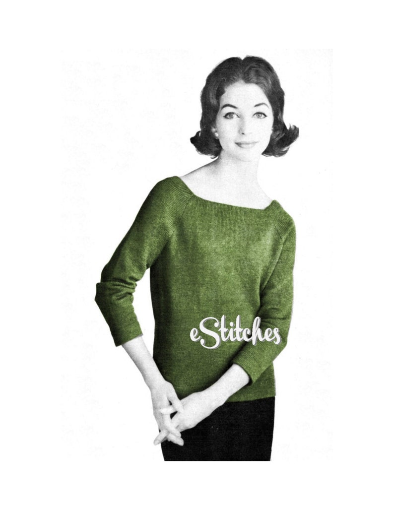 May include: A green sweater with a scoop neck and three-quarter sleeves. The sweater is knit and has a slightly textured surface. The model is wearing the sweater with black pants. The text "eStitches" is visible on the sweater.