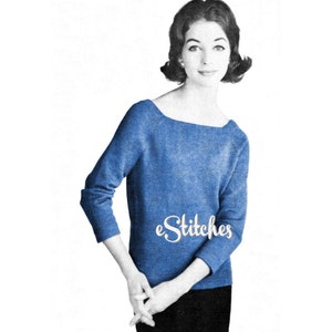 May include: A blue knitted sweater with a scoop neck and three-quarter sleeves. The sweater is worn by a woman with short dark hair. The text "eStitches" is visible on the sweater.