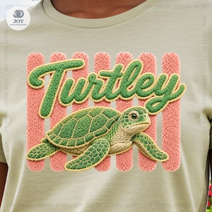 May include: A light green t-shirt with a green turtle illustration and the word "Turtley" in a textured green font. The word is set against pink vertical stripes. The turtle has a detailed, textured appearance.