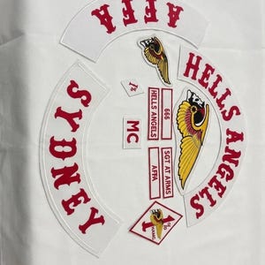 May include: White patches with red lettering and a winged skull design. The patches include the words "SYDNEY", "HELLS ANGELS", "AFFA", and "MC". Additional patches read "666" and "SGT AT ARMS".