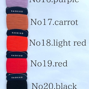 May include: Five spools of Sashiko thread stacked vertically, labeled No16 purple, No17 carrot, No18 light red, No19 red, and No20 black. Each spool features a black card with white text, 100% cotton, 40m length, and 20/4 thread weight.