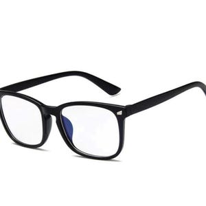 May include: Black-framed spectacles with clear lenses. The glasses have a classic rectangular shape and a glossy finish. The temples are straight and the frame is a solid black colour. The lenses appear to have a slight blue tint.