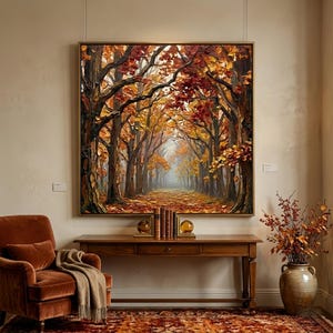 May include: A large square oil painting of an autumnal forest path. The artwork shows a pathway lined with trees in shades of red, orange, and yellow. The painting hangs above a wooden console table with books and decorative spheres.