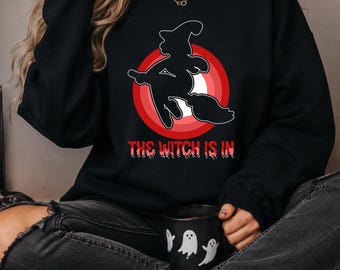The Witch Is In Shirt, Funny Halloween Sweatshirt, Cute Witch Flying Broom Pullover, Spooky Vibes Outfit, Cozy Fall Oversized Sweatshirt