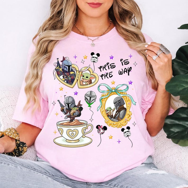 May include: Pink t-shirt featuring cartoon illustrations of characters from a popular space western series. The design includes heart-shaped frames, a teacup, and the phrase "This is Pre Way". The shirt has a crew neck and short sleeves.