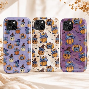 May include: Three smartphone cases featuring a repeating pattern of the blue character Stitch from Lilo & Stitch wearing witch hats and sitting inside orange pumpkins, accented with small black bats on light purple, cream, and dark purple backgrounds.