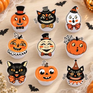 May include: A set of nine decorative Halloween-themed acrylic toppers featuring various illustrations including orange pumpkins, black cats, a ghost, and a moon face, each with a circular base and colorful details like bow ties, hats, and collars.