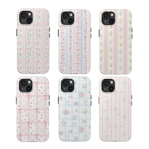 May include: Six phone cases with floral and patterned designs. The cases feature various patterns, including hearts, flowers, bows, and plaid, in pastel pink, blue, and white colors. The cases are designed to fit a smartphone.
