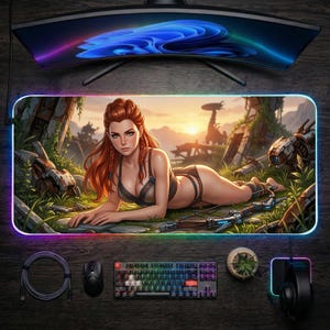 May include: A gaming mousepad featuring a woman with red hair in a fantasy setting. The mousepad has a colorful LED edge and includes a keyboard, mouse, and headset. The background shows a sunset and futuristic ruins.