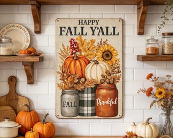 May include: A rectangular metal sign featuring the text HAPPY FALL Y'ALL above an illustration of pumpkins, sunflowers, and berries in jars. The design includes a gray jar labeled FALL, a black and white plaid jar, and an orange jar labeled thankful.