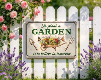 May include: A rectangular metal sign with a cream background featuring the text To plant a GARDEN is to believe in tomorrow. The design includes a central illustration of a wooden wheelbarrow filled with colorful flowers, a trowel, and a fork.