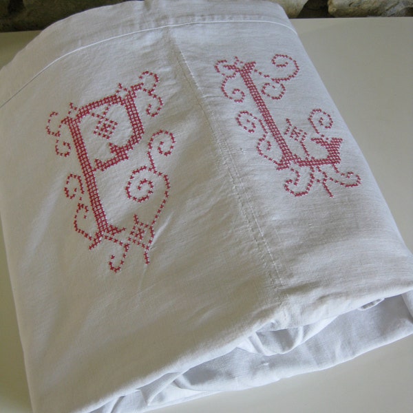 French monogrammed sheet hand loomed fabric with large red and white cross stitch initials PL