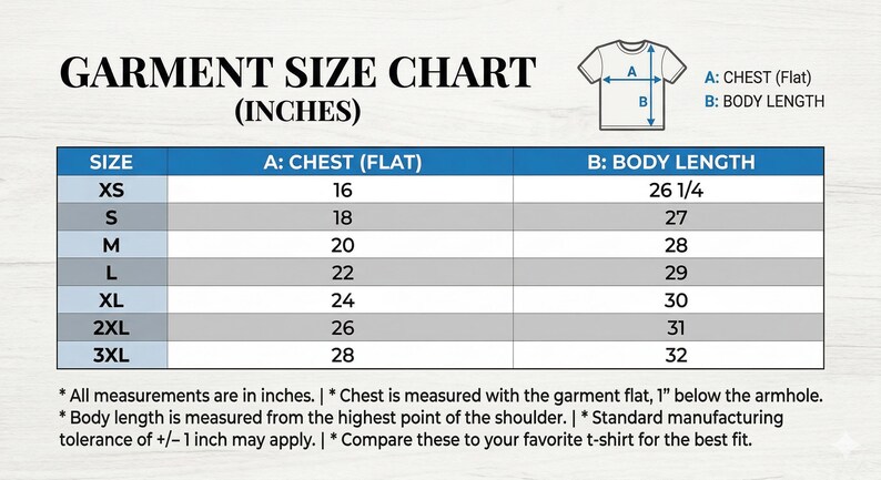 May include: A garment size chart in inches, with chest and body length measurements for XS to 3XL sizes. The chart includes a diagram of a t-shirt with labeled measurement points. Text at the bottom explains measurement details.