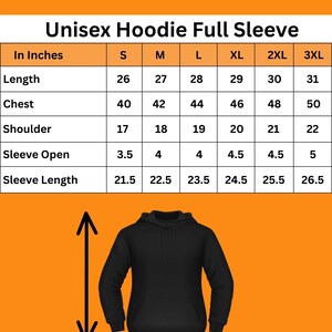 Puede incluir: Sudadera con capucha unisex negra de manga larga con una tabla de tallas en pulgadas. La tabla muestra medidas de largo, pecho, hombro, abertura de manga y largo de manga, desde la talla S hasta la 3XL. El texto "Check your Size" est&aacute; en la parte superior.