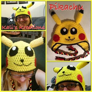 May include: A yellow crocheted Pikachu hat with black eyes, red cheeks, and a black and yellow braided cord. The hat is worn by a person with glasses.