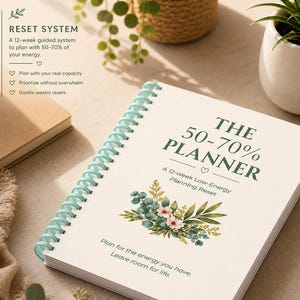 May include: A spiral-bound planner with a cream cover featuring the text THE 50-70% PLANNER, A 12-week Low-Energy Planning Reset, and Plan for the energy you have. Leave room for life. It includes a floral illustration and light blue coil binding.